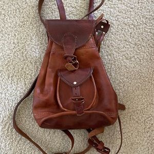 Brown small leather backpack